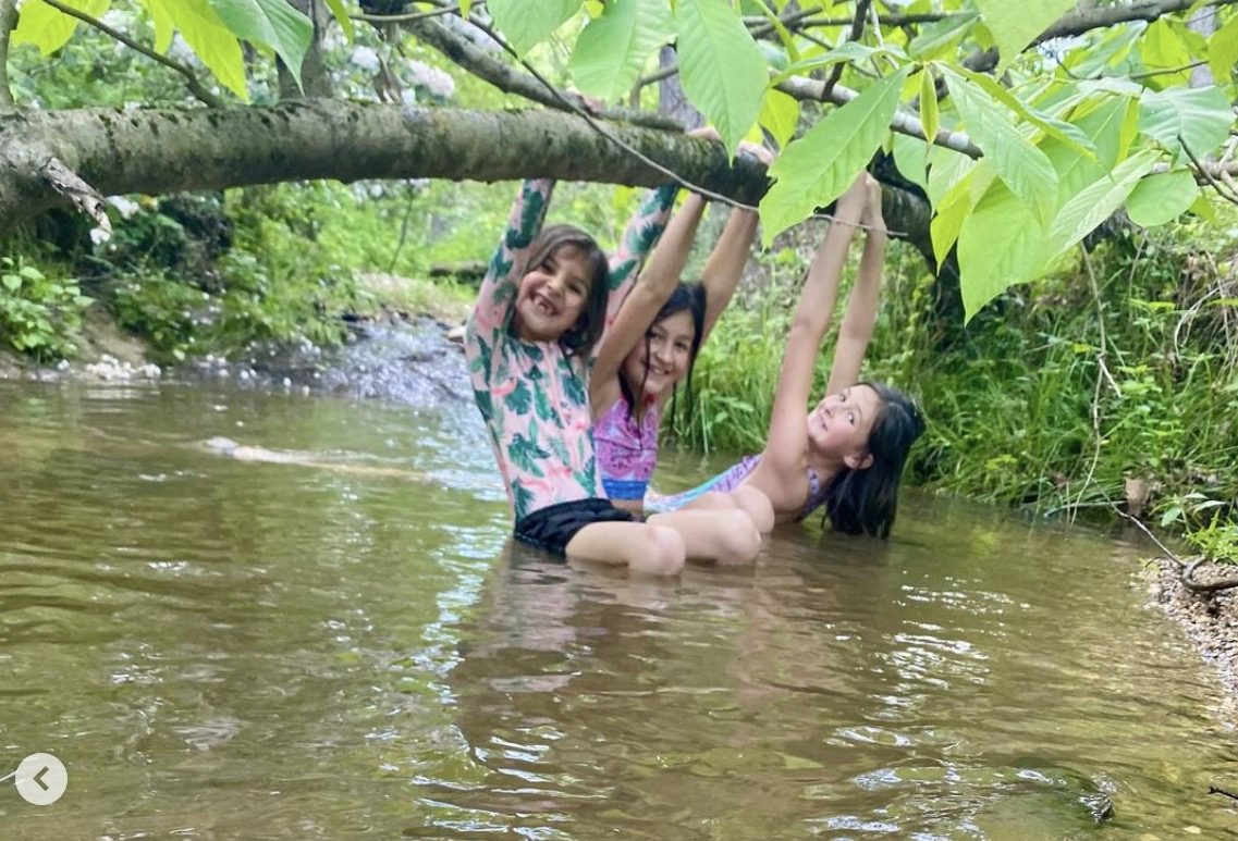 A farmer balancing work and family time at home.